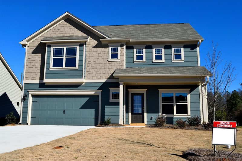 Craftsman home with a new garage door